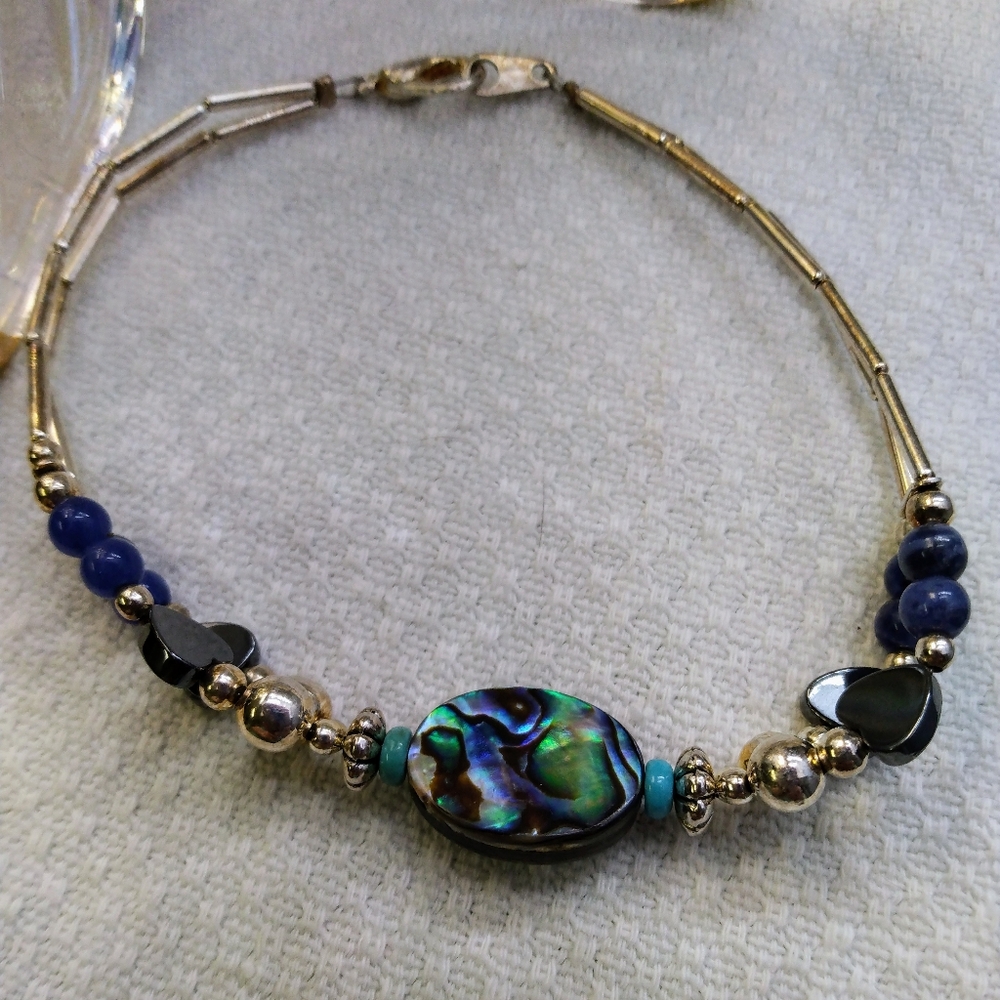 Women's multi stone bracelet with silver tone accents. 8". Good used condition. - Picture 10 of 11